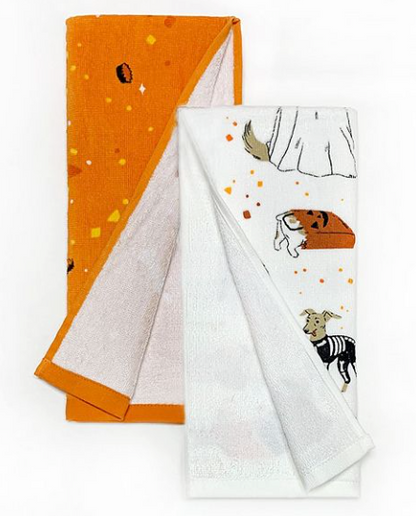 This is a set of 2 kitchen towels and one is orange and the other is white and has a chihuahua in a skeleton costume.